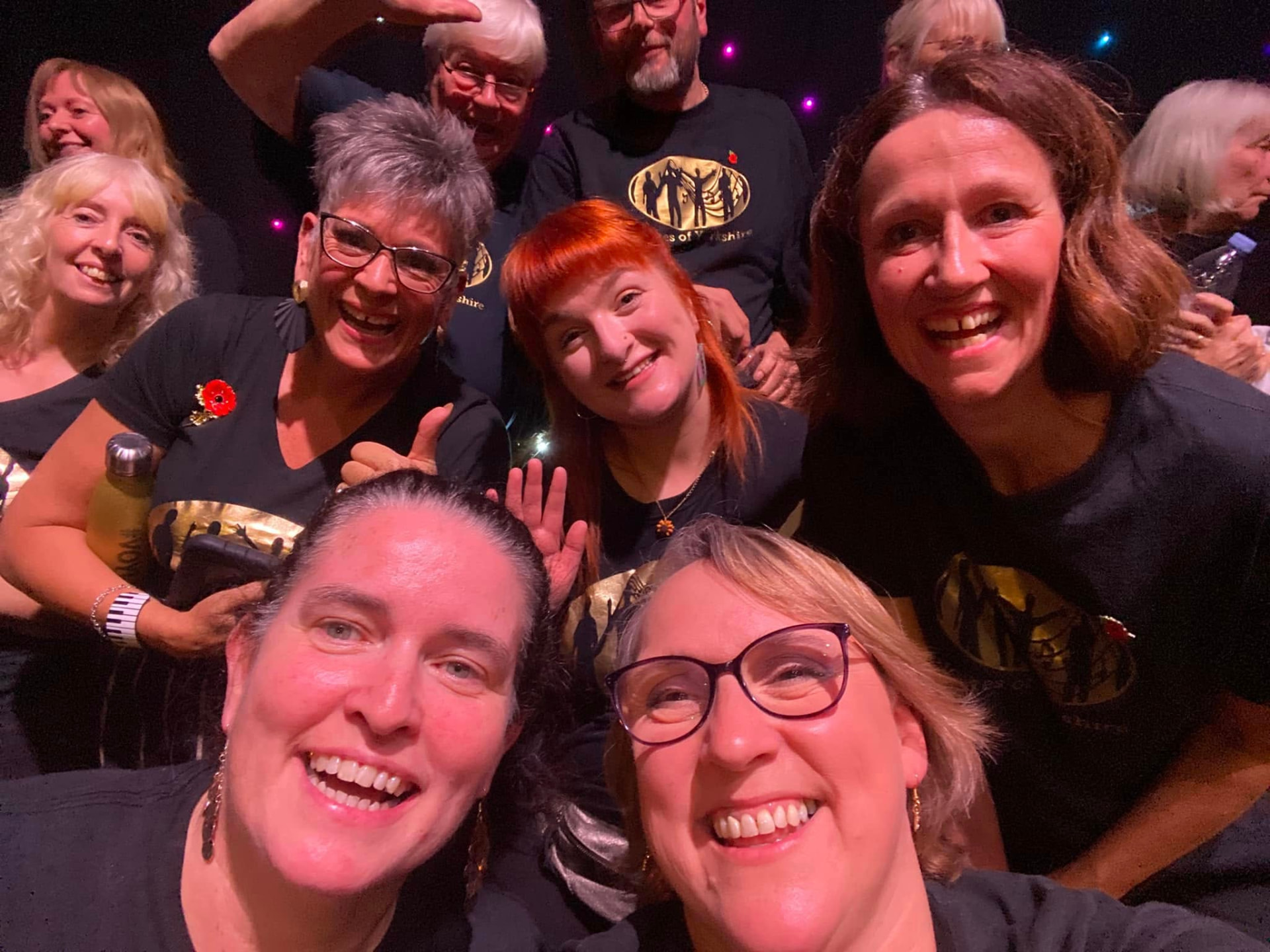 A group of VOY members squeezing in together for a selfie